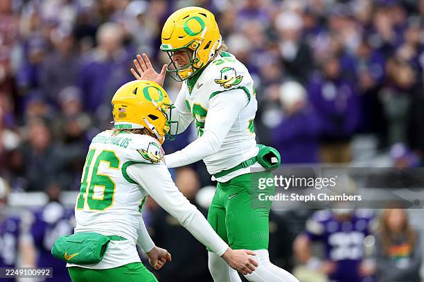 James Ferguson-Reynolds of the Oregon Ducks and Atticus Sappington of the Oregon Ducks celebrate a field goal against the Washington Huskies at Husky...