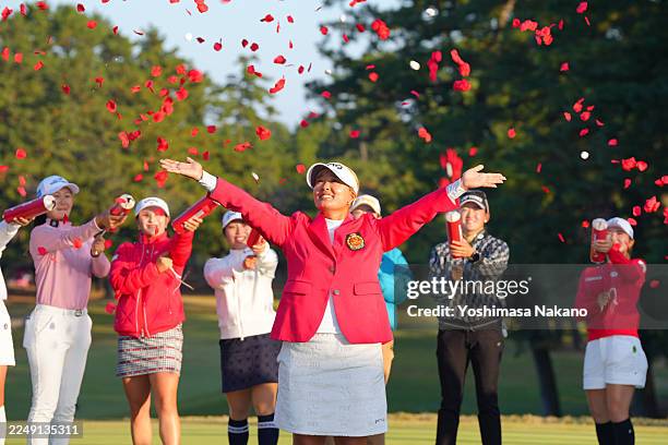 Ai Suzuki of Japan is congratulated by fellow golfers after the award ceremony following the final round of the JLPGA Tour Championship Ricoh Cup at...
