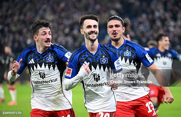 Fabio Vieira of Hamburger SV celebrates scoring his team's second goal with teammates Guilherme Ramos and Giorgi Gocholeishvili during the Bundesliga...