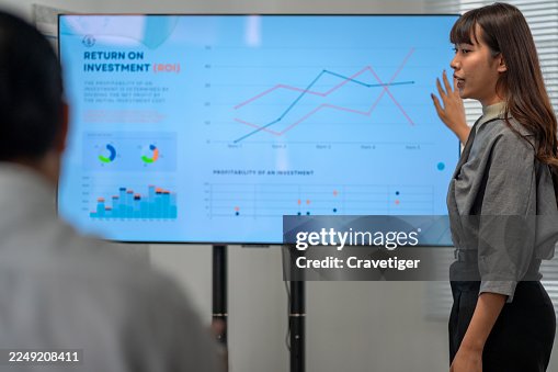 Office Meeting: Team Analyzing Performance Data. Office Meeting: Team Analyzing Performance Data.