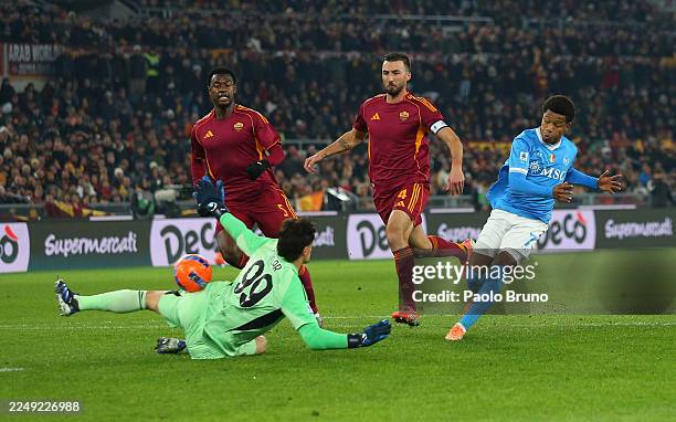 David Neres of Napoli scores his team's first goal past Mile Svilar of AS Roma during the Serie A match between AS Roma and SSC Napoli at Stadio...
