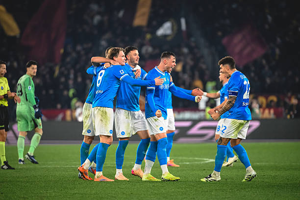 Napoli players celebrate the victory after the Serie A match between AS Roma and SSC Napoli at Stadio Olimpico on November 30, 2025 in Rome, Italy.