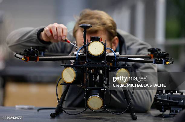 Developer prepares a drone called "Raven", an Electronic Warfare System, by team Stark, during the Spectra Challenge competition in Erding near...