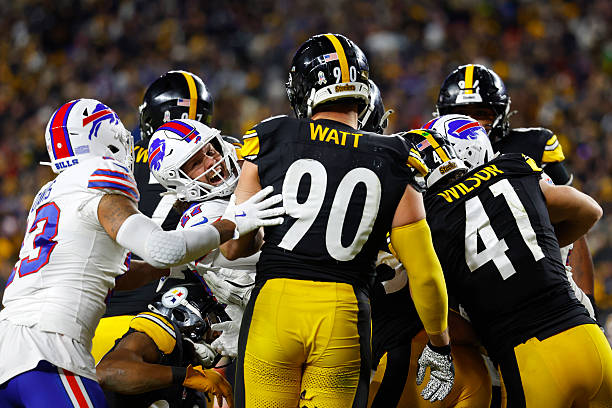 Josh Allen of the Buffalo Bills celebrates after his rushing touchdown against the Pittsburgh Steelers in the fourth quarter of a game at Acrisure...