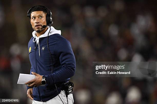 Head coach Marcus Freeman of the Notre Dame Fighting Irish looks on against the Stanford Cardinal in the first quarter at Stanford Stadium on...