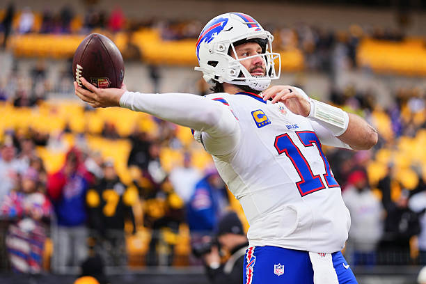 Josh Allen of the Buffalo Bills warms up before kickoff against the Pittsburgh Steelers during an NFL football game at Acrisure Stadium on November...