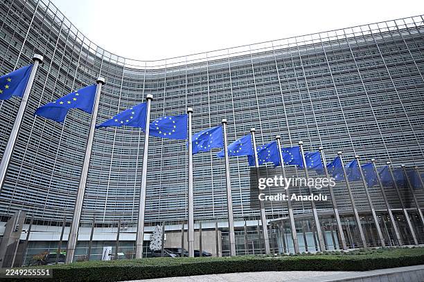 View of the Berlaymont building and European Union flags in Brussels, Belgium on December 04, 2025.