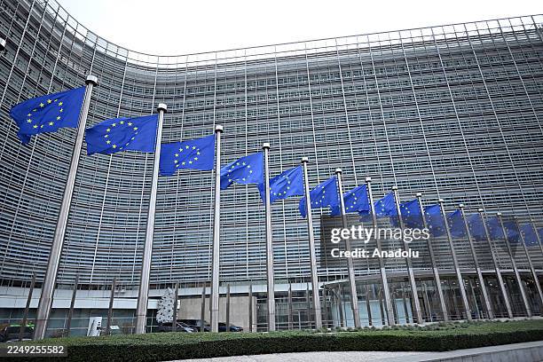 View of the Berlaymont building and European Union flags in Brussels, Belgium on December 04, 2025.