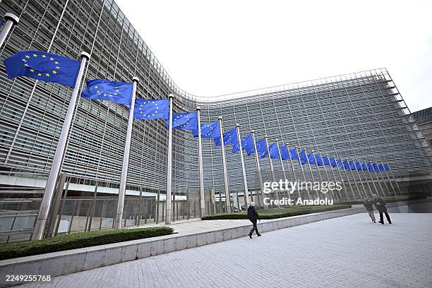 View of the Berlaymont building and European Union flags in Brussels, Belgium on December 04, 2025.
