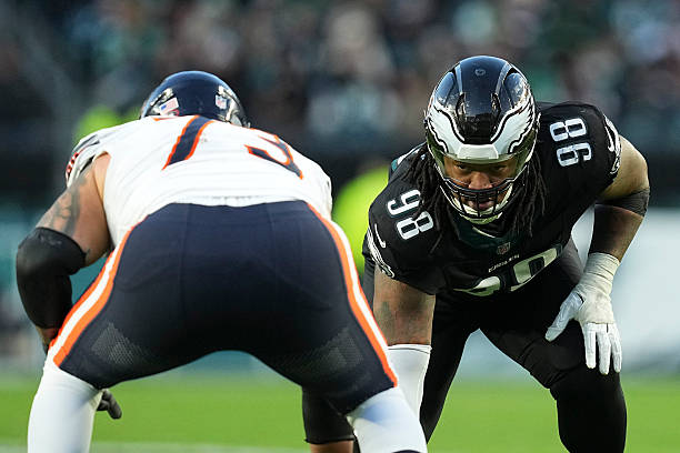 Jalen Carter of the Philadelphia Eagles looks on against Jonah Jackson of the Chicago Bears at Lincoln Financial Field on November 28, 2025 in...