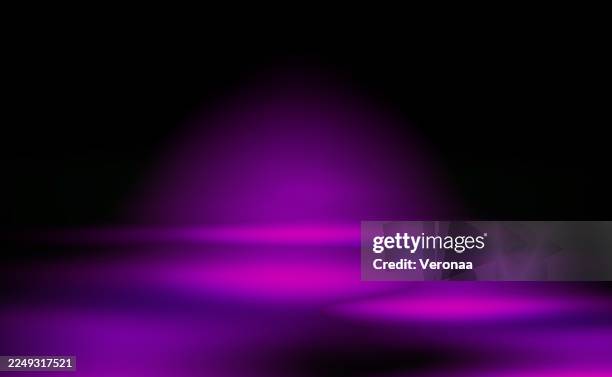 blurry glow purple light beams on a black background. studio black wall background template with purple light. - wallpapering decorating stock illustrations