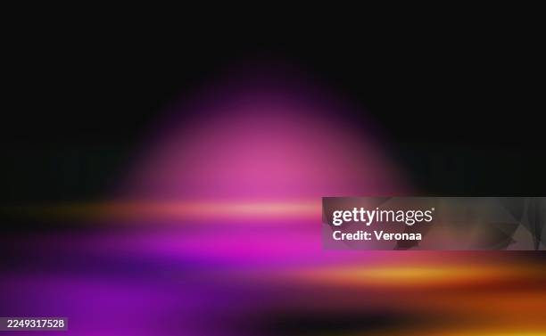 blurred multi-colored glowing light rays on a black background. template for a black studio wall background with multi-colored light. - interior design studio stock illustrations