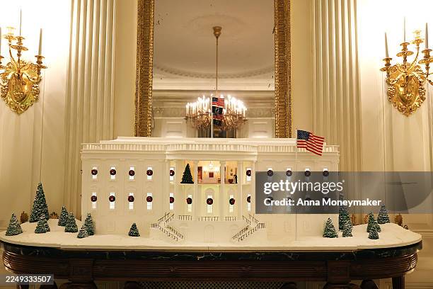 The Gingerbread White House is displayed in the State Dining Room during an advance tour of the 2025 White House Christmas decorations on December...