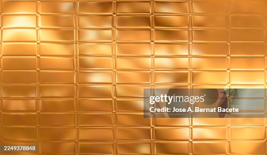 Abstract background, gold sheet divided into rectangular tablets. Abstract background, gold sheet divided into rectangular tablets.
