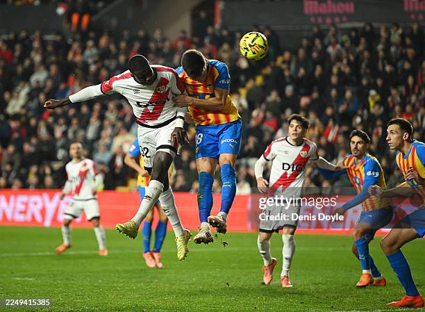 Nobel Mendy of Rayo Vallecano scores his team's first goal under pressure from Pepelu of Valencia CF during the LaLiga EA Sports match between Rayo...
