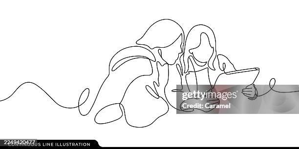 continuous line drawing of two people looking at a digital tablet together - continuous line drawing stock illustrations
