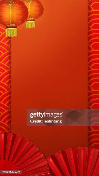 Red Chinese lantern with red folding fan on a colored background. Mockup, template, or copy space. Decoration for Lunar or Chinese New Year celebration