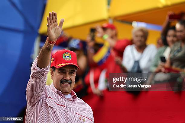 President Nicolas Maduro of Venezuela greets his supporters during a protest to support him on December 1, 2025 in Caracas, Venezuela. Supporters...
