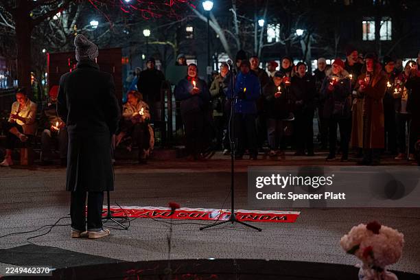 Members of the public, including activists with the group NYC Order of Sisters, gather with others at the New York City AIDS Memorial in observance...
