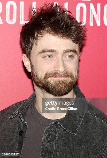 Daniel Radcliffe poses at the NYC screening for the new film based on the Broadway musical by Stephen Sondheim "Merrily We Roll Along" at The Hudson...