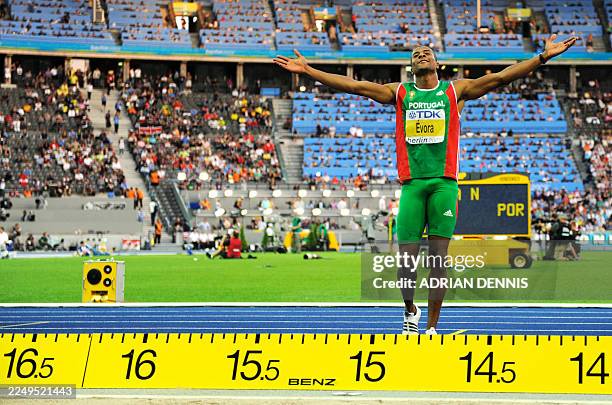 Portugal's Nelson Evora gestures during the men's triple jump final of the 2009 IAAF Athletics World Championships on August 18, 2009 in Berlin. AFP...
