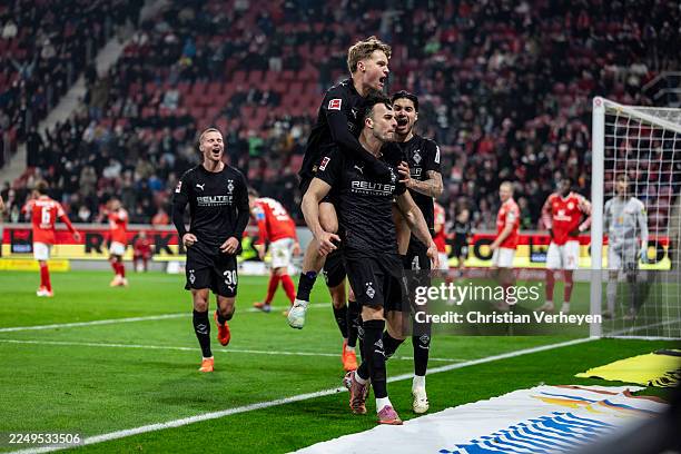 Haris Tabakovic, Luca Netz and Kevin Diks of Borussia Moenchengladbach celebrate their teams first goal during the Bundesliga match between 1. FSV...