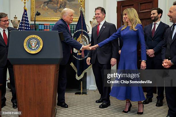 President Donald Trump is greets tech billionaires Michael Dell , his wife Susan Dell while making an announcement about "Trump accounts" in the...