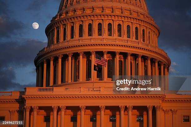 The moon is visible behind the U.S. Capitol prior to the U.S. Capitol Christmas Tree lighting ceremony on December 02, 2025 in Washington, DC. This...