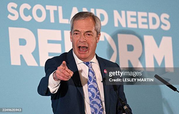 Reform UK leader, Nigel Farage speaks on stage at a rally in Falkirk, Scotland, on December 6, 2025. Populist leader Nigel Farage rallied supporters...