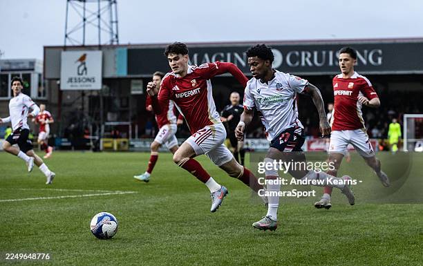 Bolton Wanderers' Thierry Gale competing with Swindon Town's Jamie Knight-Lebel during the Emirates FA Cup Second Round match between Swindon Town...