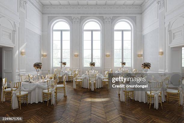 luxurious wedding reception hall with golden chairs and elegant table settings - wedding reception stock pictures, royalty-free photos & images