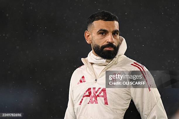 Liverpool's Egyptian striker Mohamed Salah warms up ahead of the English Premier League football match between Leeds United and Liverpool at Elland...