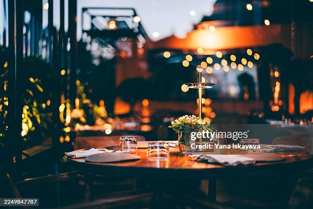 elegant and romantic night out dinner setup. abstract no people background - överklass bildbanksfoton och bilder
