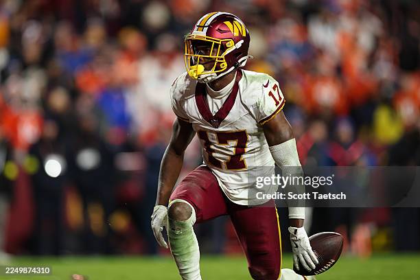 Terry McLaurin of the Washington Commanders catches a pass against the Denver Broncos during overtime of the NFL game at Northwest Stadium on...