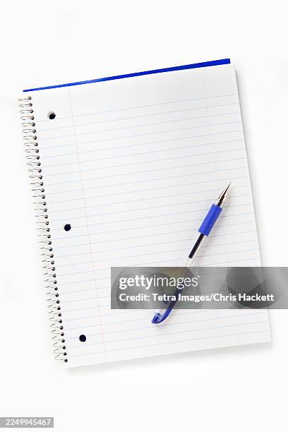 wirebound notebook and pen on white background - spiral bound notebook stock pictures, royalty-free photos & images