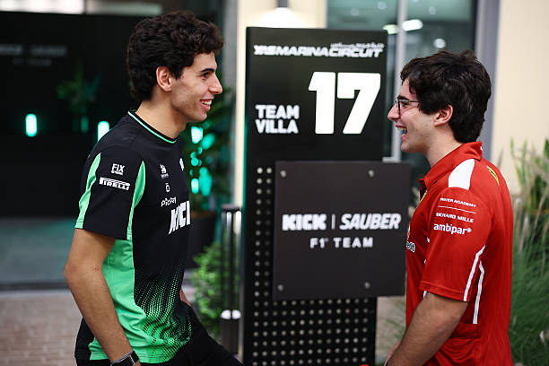 Gabriel Bortoleto of Brazil and Stake F1 Team Kick Sauber talks with 2025 Fomula 3 Champion Rafael Camara of Brazil and Trident in the Paddock during...