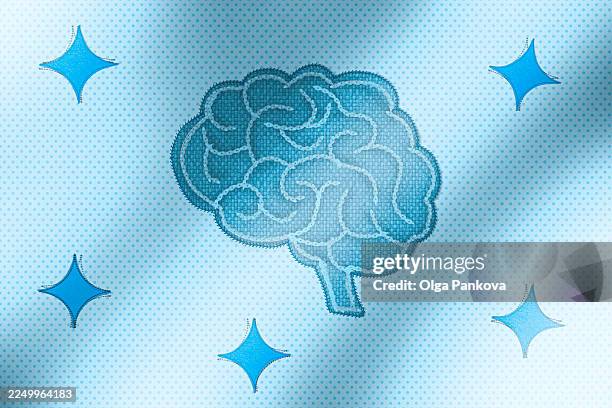 brain illustration shining with sparkles on dotted blue background - plasticité neuronale photos et images de collection