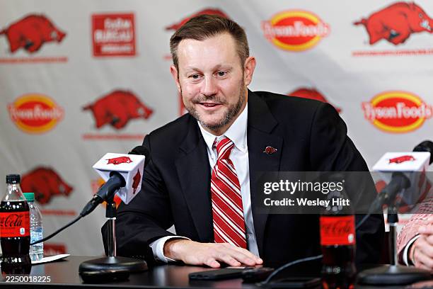 New Arkansas Razorback football Head Coach Ryan Silverfield answers question from reporters at his introduction press conference in the Broyles...