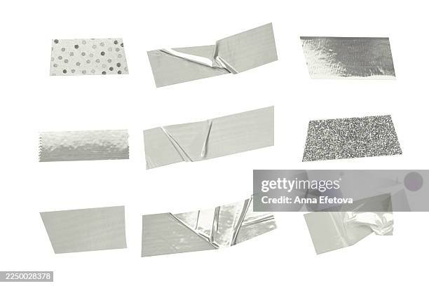 collection of assorted silver adhesive tapes and duct tape pieces. color of 2026 year - dancer in the white cloud - plakband stockfoto's en -beelden