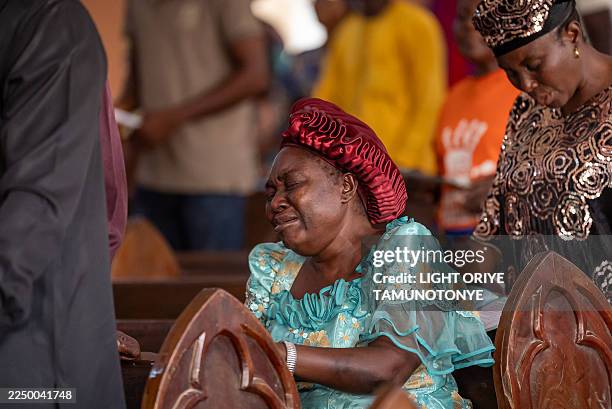 Worshipper prays at the Evangelical Church Winning All during a prayer called by the Christian Association of Nigeria in Minna on December 7, 2025....