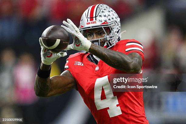 Ohio State Buckeyes wide receiver Jeremiah Smith warms up on the field during the Big 10 Championship game between the Ohio State Buckeyes and...