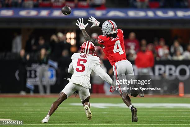 Ohio State Buckeyes wide receiver Jeremiah Smith catches a pass against Indiana Hoosiers defensive back D'Angelo Ponds during the Big 10 Championship...
