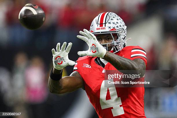Ohio State Buckeyes wide receiver Jeremiah Smith warms up on the field during the Big 10 Championship game between the Ohio State Buckeyes and...