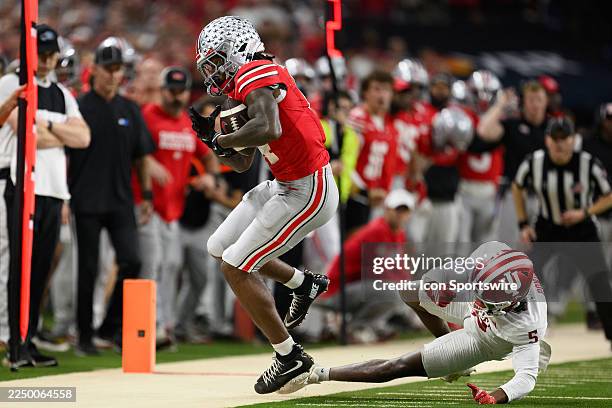 Ohio State Buckeyes wide receiver Jeremiah Smith catches a pass against Indiana Hoosiers defensive back D'Angelo Ponds during the Big 10 Championship...
