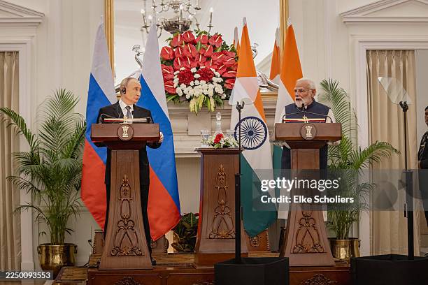 Russian President Vladimir Putin and India's Prime Minister Narendra Modi attend a presentation of a joint statement after their delegation level...