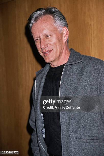 American actor James Woods, wearing a grey zip-front jacket over a black t-shirt, attends the 1998 Divine Design Gala at the Pacific Design Center in...