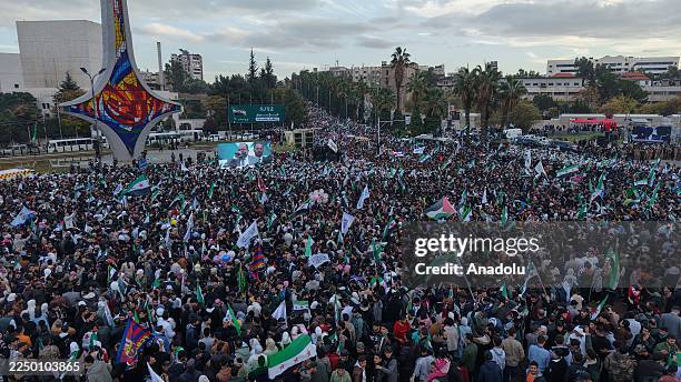 Thousands of people gather at Umayyad Square to celebrate the first anniversary of the fall of Bashar al-Assad's regime in Damascus, Syria on...