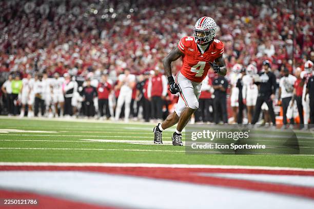 Ohio State Buckeyes Wide Receiver Jeremiah Smith runs a route during the Big Ten Conference Championship game between the Indiana Hoosiers and the...