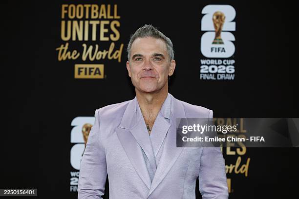 Robbie Williams poses on the red carpet prior to the FIFA World Cup 2026 Official Draw at John F. Kennedy Center for the Performing Arts on December...