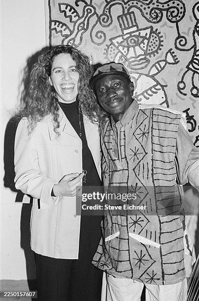 Portrait of American publicist Jane Blumenfeld Silverman Berman and Senegalese musician Vieux Diop backstage at Tramps, New York, New York, February...